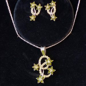 Silver and green crystal earrings and necklace set
